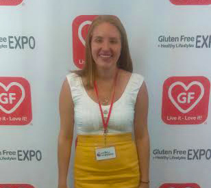 Here's an alt text option: Woman at Gluten-Free Expo.