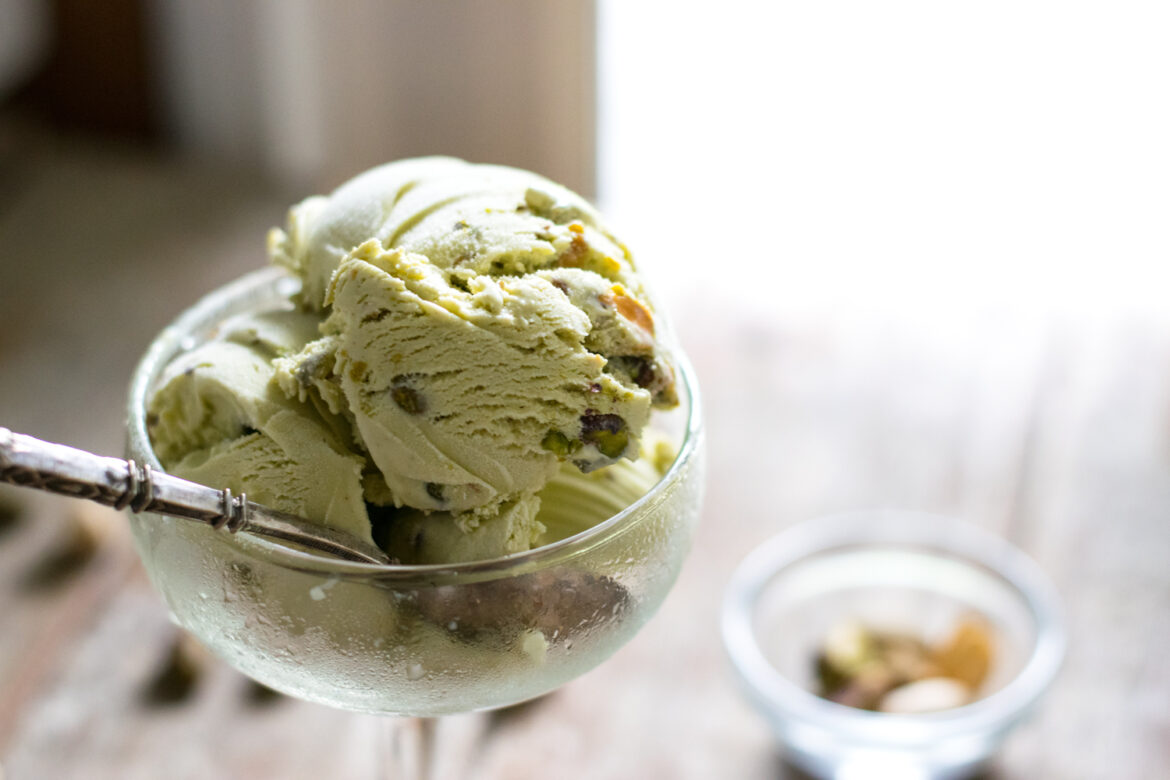 A bowl of ice cream sitting on top of a table.